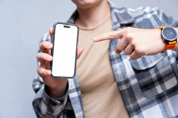 Man Holding Modern Smartphone and Pointing at Screen - Concept of Smartphone Mockup
