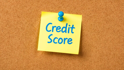 Credit score word written on a note sticky on corkboard
