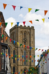 Festive Church Tower with Colorful Bunting in Ripon, UK