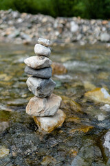 Tower of stones placed one above the other as a symbol of balance - Austria - Kitzbuhel