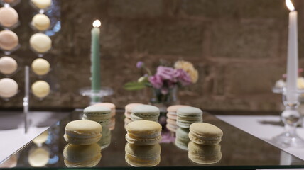Colorful tasty macaroons in a row. Traditional french colorful macarons. Delicious wedding candy bar