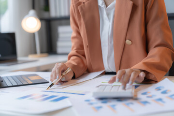 Business Documents concept : Employee woman hands working in Stacks paper files for searching and checking unfinished