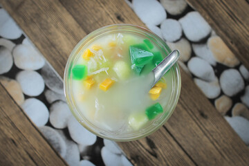 Refreshing jelly drink infused with lychee syrup served in a glass. Beverage concept