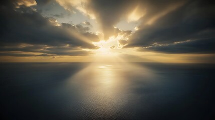 Fototapeta premium Serene Aerial Shot of Sunbeam Piercing Through Clouds above Tranquil Ocean, National Geographic Quality Photography