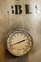 Close up of temperature gauge on the beer tank in local brewery