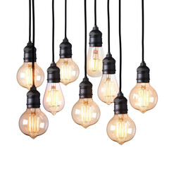 Obraz premium Elegant cluster of vintage-style hanging light bulbs showcasing warm illumination in a modern interior setting
