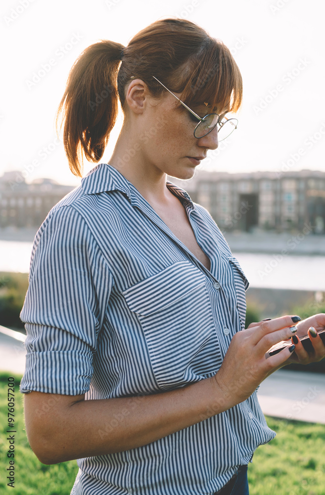 Poster side view of attractive millennial blogger typing text content for publishing in social networks con