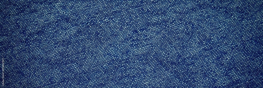 Poster blue denim fabric texture with diagonal weaving patterns and soft lighting, creating a classic and r