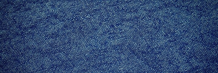 Fototapeta premium Blue denim fabric texture with diagonal weaving patterns and soft lighting, creating a classic and rugged look, ideal for fashion, textile design, or background concepts for creative projects 
