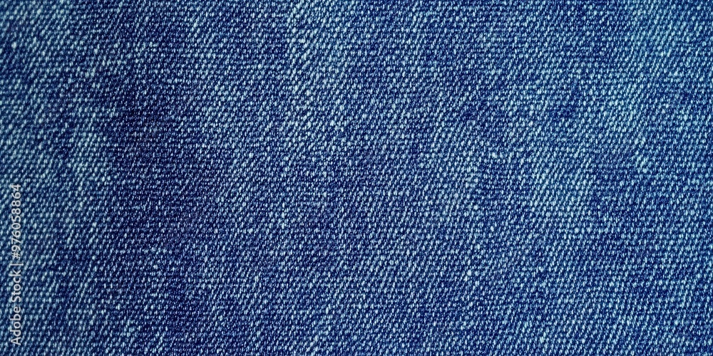 Poster blue denim fabric texture with diagonal weaving patterns and soft lighting, creating a classic and r