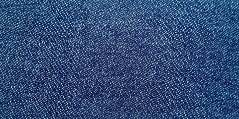 Fototapeta premium Blue denim fabric texture with diagonal weaving patterns and soft lighting, creating a classic and rugged look, ideal for fashion, textile design, or background concepts for creative projects 