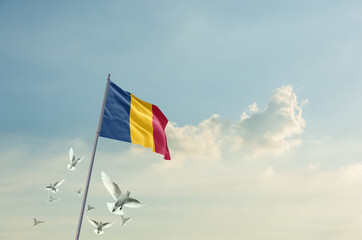 Chad flag waving with flying doves in beautiful sky. Chad flag for Republic Day and Independence...