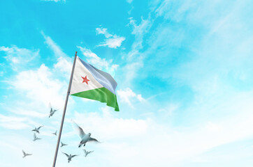 Djibouti flag waving with flying doves in beautiful sky. Djibouti flag for Republic Day and...