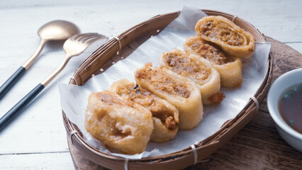 Gohyong is typical chinesse food served with sliced ​​chilies and cuko sauce.