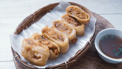Gohyong is typical chinesse food served with sliced ​​chilies and cuko sauce.