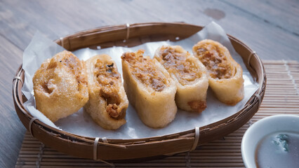 Gohyong is typical chinesse food served with sliced ​​chilies and cuko sauce.