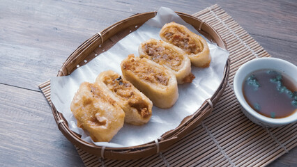 Gohyong is typical chinesse food served with sliced ​​chilies and cuko sauce.