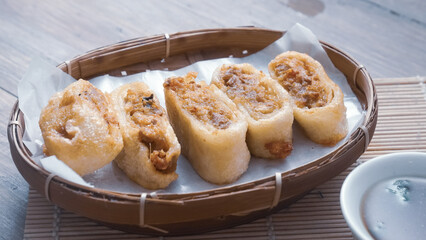 Gohyong is typical chinesse food served with sliced ​​chilies and cuko sauce.