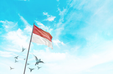 Monaco flag waving with flying doves in beautiful sky. Monaco flag for Republic Day and Independence Day.