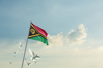 Vanuatu flag waving with flying doves in beautiful sky. Vanuatu flag for Republic Day and Independence Day.