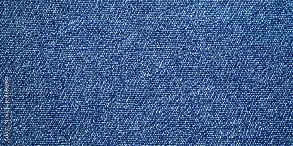 Poster blue denim fabric texture with diagonal weaving patterns and soft lighting, creating a classic and r