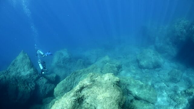 underwater scenery of rocks and reefs mediterranean sea blue water