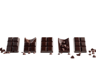 Five stages of a chocolate bar being unwrapped and bitten, isolated on white.  PNG transparent.