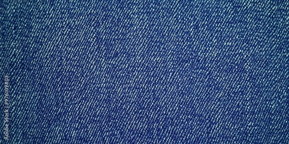 Poster blue denim fabric texture with diagonal weaving patterns and soft lighting, creating a classic and r