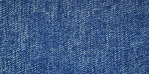 Naklejka premium Blue denim fabric texture with diagonal weaving patterns and soft lighting, creating a classic and rugged look, ideal for fashion, textile design, or background concepts for creative projects 