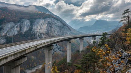 Fototapeta premium The A1 Highway Bridge in Kastelec, Slovenia, encircles a mountain.