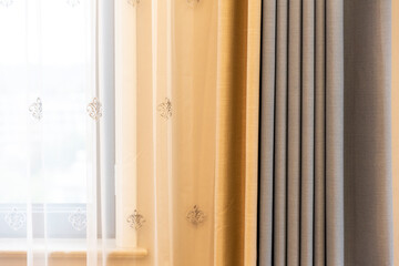 Blue and white patterned curtains in the bedroom