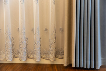 Blue and white patterned curtains in the bedroom