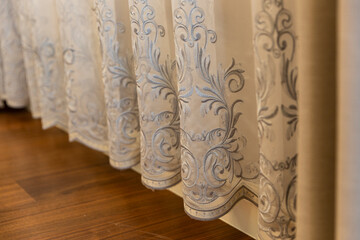 Details of patterned curtains in the bedroom