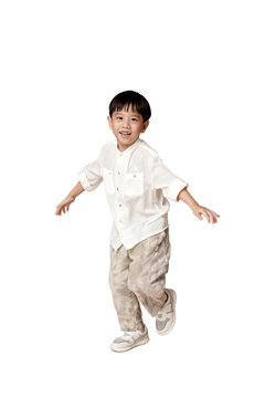 Naklejki Happy Asian young boy in casual attire, smiling and playing, isolated on white background. Perfect for family and childhood themes. transparent PNG white background.
