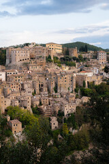 Obraz premium View of Sorano, an ancient medieval hill town composed of tuff stone over the Lente River. Etruscan town. Province Grosseto, Tuscany, Italy.
