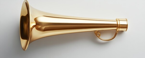 Obraz premium Golden horn lying on white background