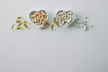 Tablets and vitamins on white background, banner advertising, pharmaceuticals