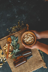 Natural organic vitamins in hands close-up