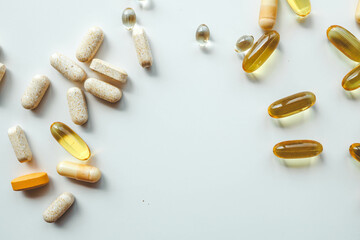 Different vitamins on white background, banner healthcare and medicine