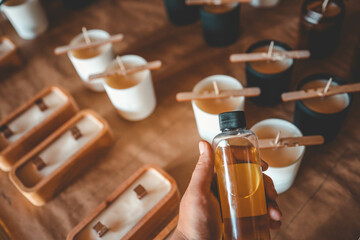 Candle making aroma in hands close-up, workshop