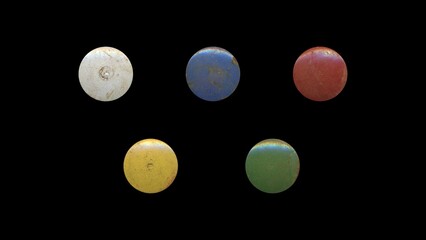 a set of colorful aged circles, rusty stationery tacks, isolated front view metal push rounded pins on black background	