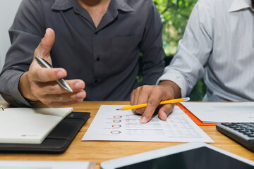 Business team meeting and discussing project plan. Businessmen discussing together in meeting room. Professional investor working with business project together. Finance managers task.