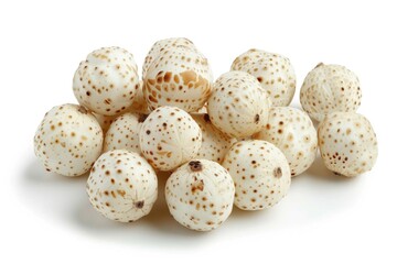 Obraz premium A collection of white and brown speckled eggs on a clean white surface, ideal for use in cooking, baking or decorating