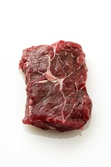 Obraz premium Close-up shot of raw steak on a white surface, ideal for food-related content and illustrations
