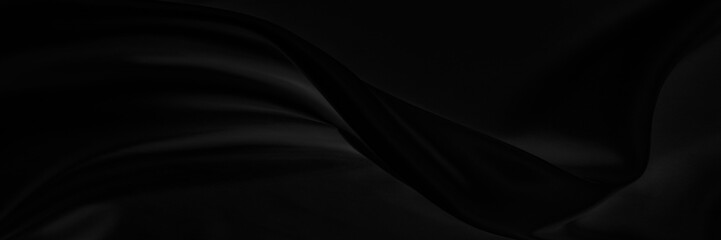 Black gray satin dark fabric texture luxurious shiny that is abstract silk cloth panorama background with patterns soft waves blur beautiful.