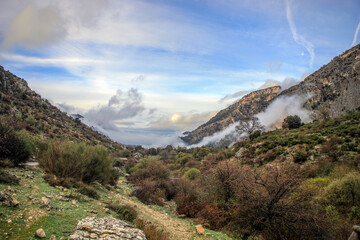 Spectacular view of the mountains and valley of the Sierra de Castril natural park in Granada, Andalusia, Spain with cloudy sky