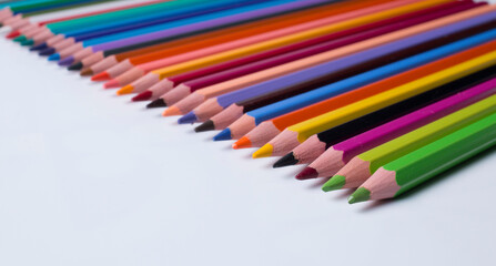 pencils of different colors on a white background