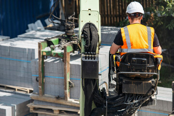 Working Safely at Construction Site While Operating Heavy Machinery During the Day