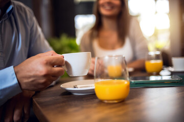 Portrait of cup of coffee. Group of friends hanging out at the cafe.