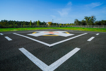Fototapeta premium Large paved area with a special symbol in the center for helicopter landing